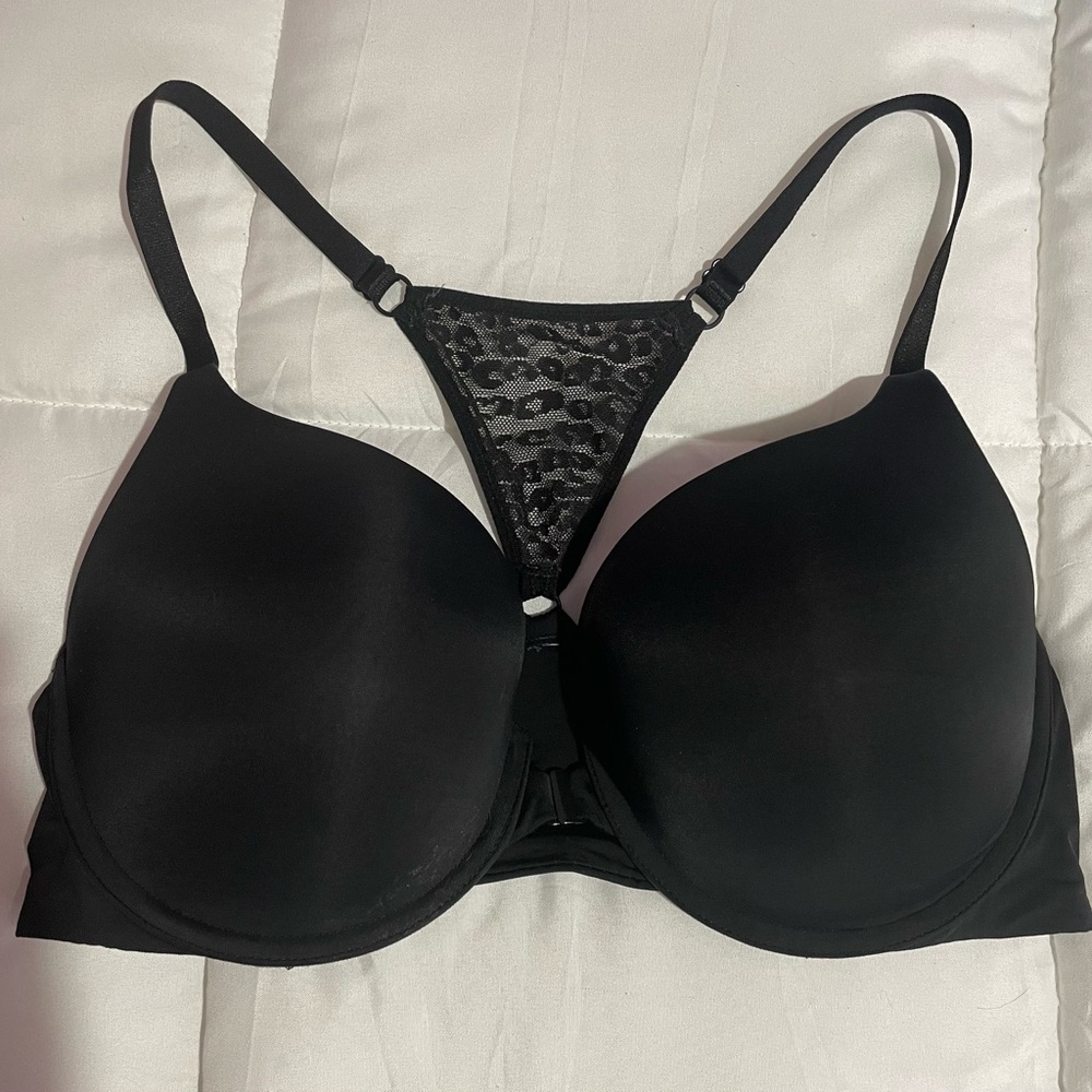 Victoria’s Secret Black T-back bra with lace detail, hooks in front. Size 36D